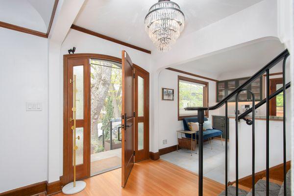 Beautiful woodwork and iron railing upon entry