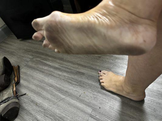 Black foot after showered in a few steps.   Yuck