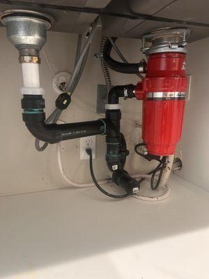 Gorgeous garbage disposal & drain installation. Everything under the sink is brand new, shiny & draining properly!