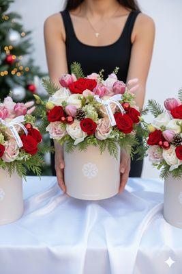 Fresh Christmas flowers arranged in our signature box. Holiday bouquet with seasonal blooms and winter greens in Fairfax.