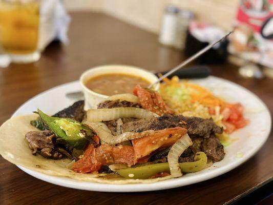 Combo Fajita Toreadas with charro beans and rice.