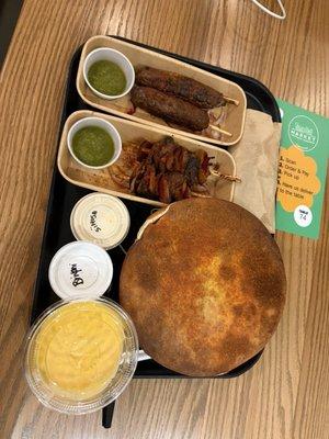 Biryani, lamb kebab, beef kebab, samosas (in the bag), lassi