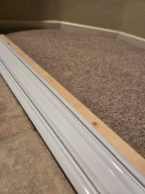 After photo of closet sliding door rail. Carpet and hardwood clean!