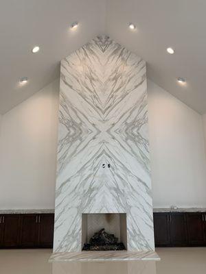 Bookmatched Full-Height Fireplace.