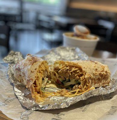 The Piada - DIY with pasta, diavolo sauce, sausage, cucumbers, olives, pancetta, arugula and creamy parm dressing