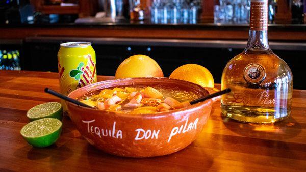 The Cazuela de Don Pilar, our house cocktail. Made with Tequila Don Pilar, citrus juices, Squirt and fruit.