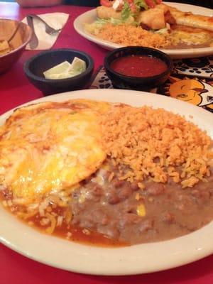 This is the huevo ranchero plate with three eggs, rice and beans! The chile and cheese sauce was awesome!