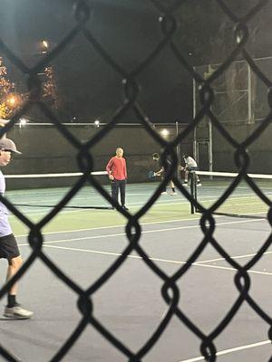 This guy in red running a camp claiming all 4 courts. Get him out