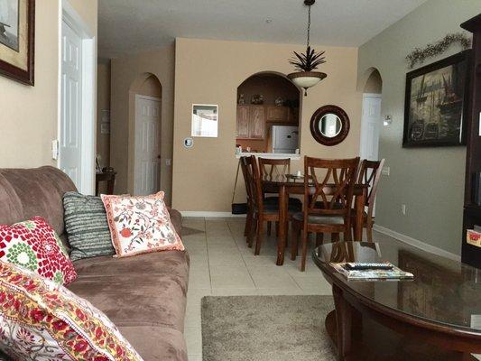 Living area view to dining and kitchen beyond