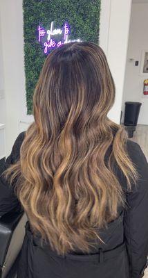 Custom color, sew-in extensions, waves.