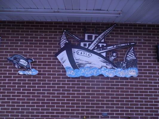 Exterior wall gives a clue that they serve seafood, in addition to chicken and fish.