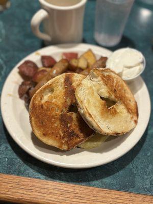 Grilled bagel, home fries scrambled eggs sausage
