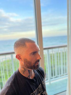 Adam Levine mobile call
Mid skin fade and beard