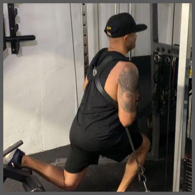 Vik doing split squats with the world famous Squat Harness