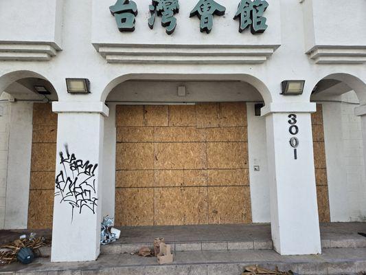 boarded up main entrance of a mall