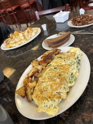 Omelette, home fries, corned beef hash, toast