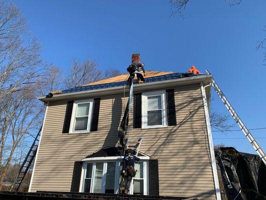 Precision Roofing at work early morning