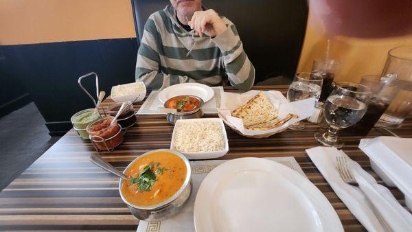 entrees with naan, rice and condiments
