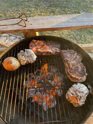 Grilling the meat with potatoes, bought from Locker!!