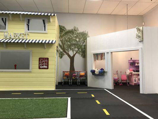 The playhouses at Let's Play, Man Cave, Farmhouse and the Market.