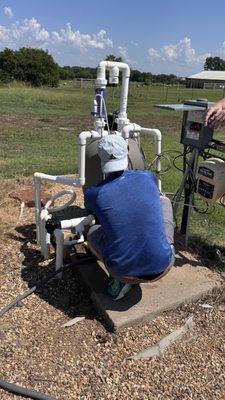 Our lead Maintenence Tech (Samuel), performing maintenence on a faulty pump connected to a salt cell.