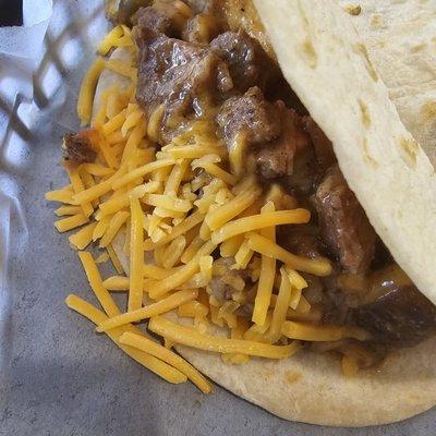 Carne guisada with cheese