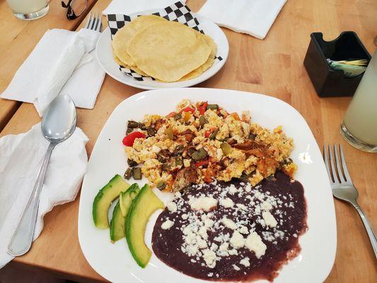 Nopales and eggs with beans, avocado and homemade corn tortillas