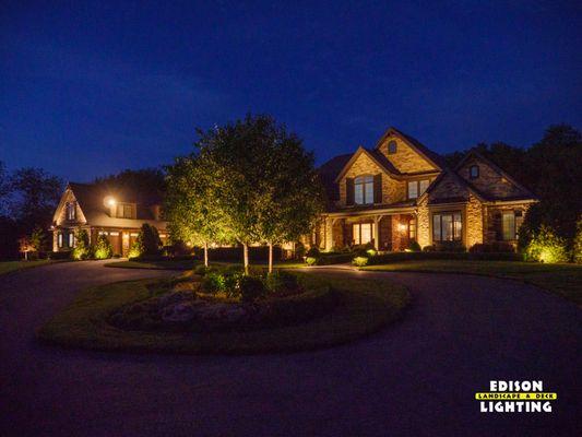Accent lighting, tree lighting, driveway lights in front of a contemporary home