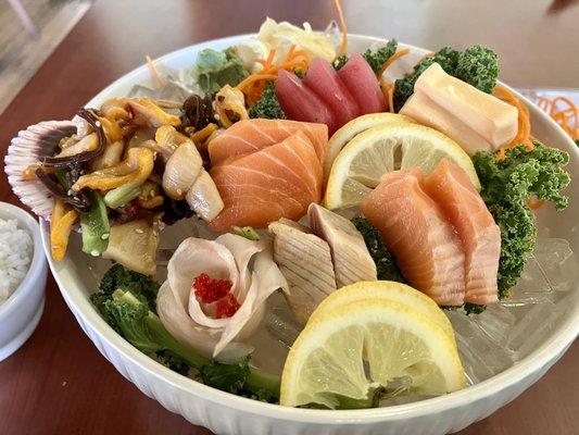 Dinner Sashimi combo. Calamari salad, 5 thin snapper w/roe, 4 salmon, 3 tuna, two white tuna, & 2 albacore tuna. W/rice & soup.
