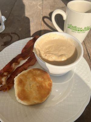 Biscuit, sausage gravy, bacon and coffee