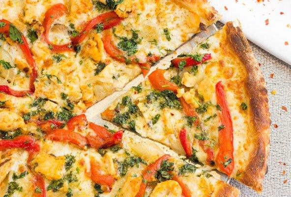 Spicy Pepper Chicken Pizza... chicken breast, roasted red peppers, caramelized onions, cilantro, oregano, red pepper flakes, no tomato sauce