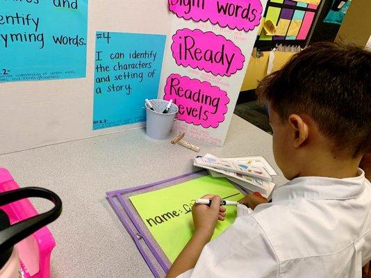 Showing us his work during the Student Led Conference