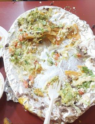 Almost finished plate of nachos.