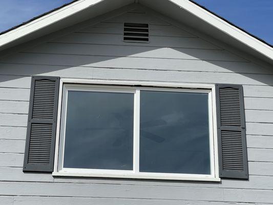 AFTER, outside view of second upstairs bedroom. Two windows replaced with one bigger window.
