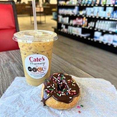 Yummy Cold Brew latte and our vanilla cake donut with chocolate icing and sprinkles.