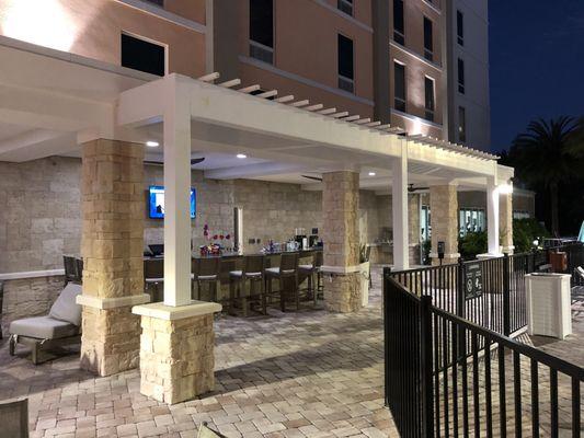 The bar is located poolside in the Holiday Inn.