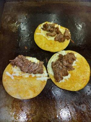 Quesataco with consome for dipping.