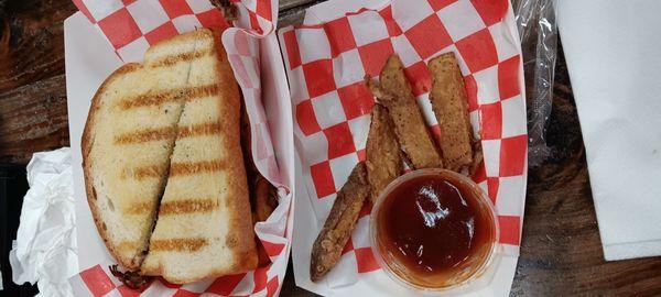 Brisket sandwich and what was left of his fries