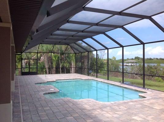 screen pool enclosure with paver deck