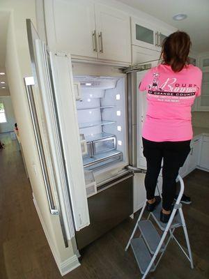 Cleaning the refrigerator in the second kitchen here in Irvine