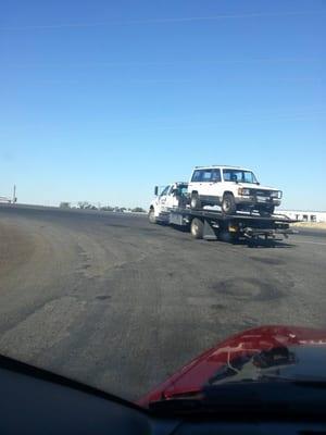 Our truck getting a courtesy tow to Fenders!