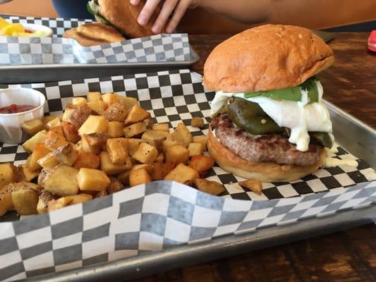 Brunch turkey and egg burger. Potatoes are nice and crunchy. Recommend adding hot sauce to burger for a little more flavor