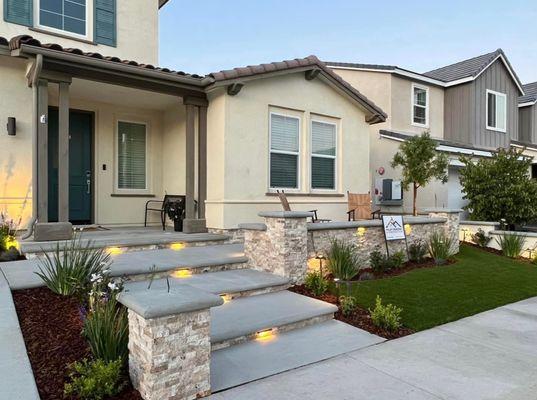 Stacked stone compliments these extra wide entry steps and front porch