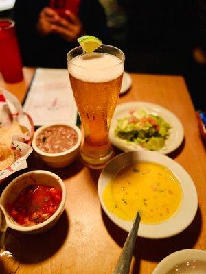 Modelo Especial with queso, salsa, charro beans, and guacamole