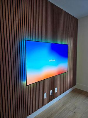 65" Samsung S90 OLED with a new outlet and in wall wiring. 8' x 10' Acoustic wall panel install.