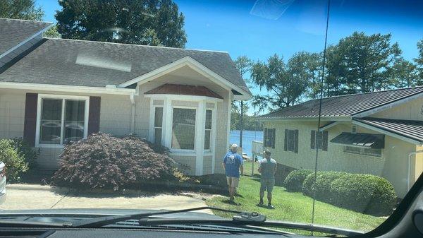 Talking with the roofing professional.