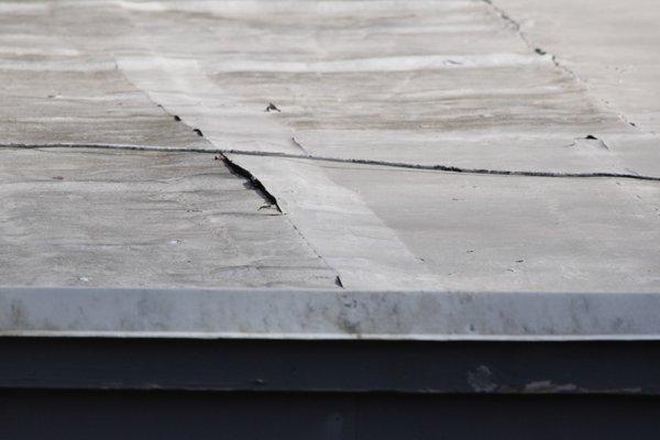 Before the work I put tape over a seam to TEMPORARILY staunch a leak. M&M put the coating OVER the TAPE instead of removing it. Sloppy