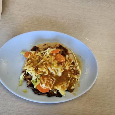 Pupusa with cheese and loroco