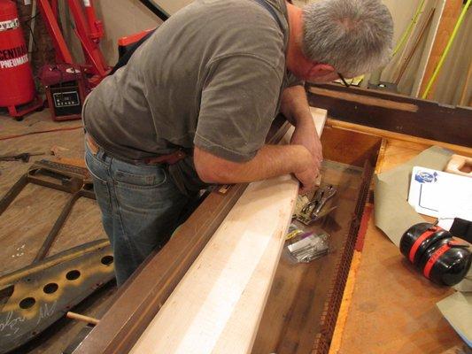 Fitting new pinblock into Steinway grand cabinet.