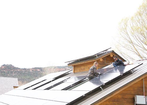 Dusty & Scott installing solar panels